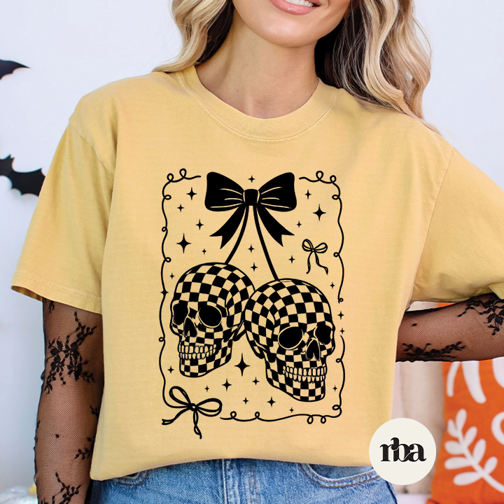 Checkered Skulls Halloween graphic T-shirt mockup.